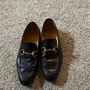 Gucci Black Leather Loafers with Gold Accents
